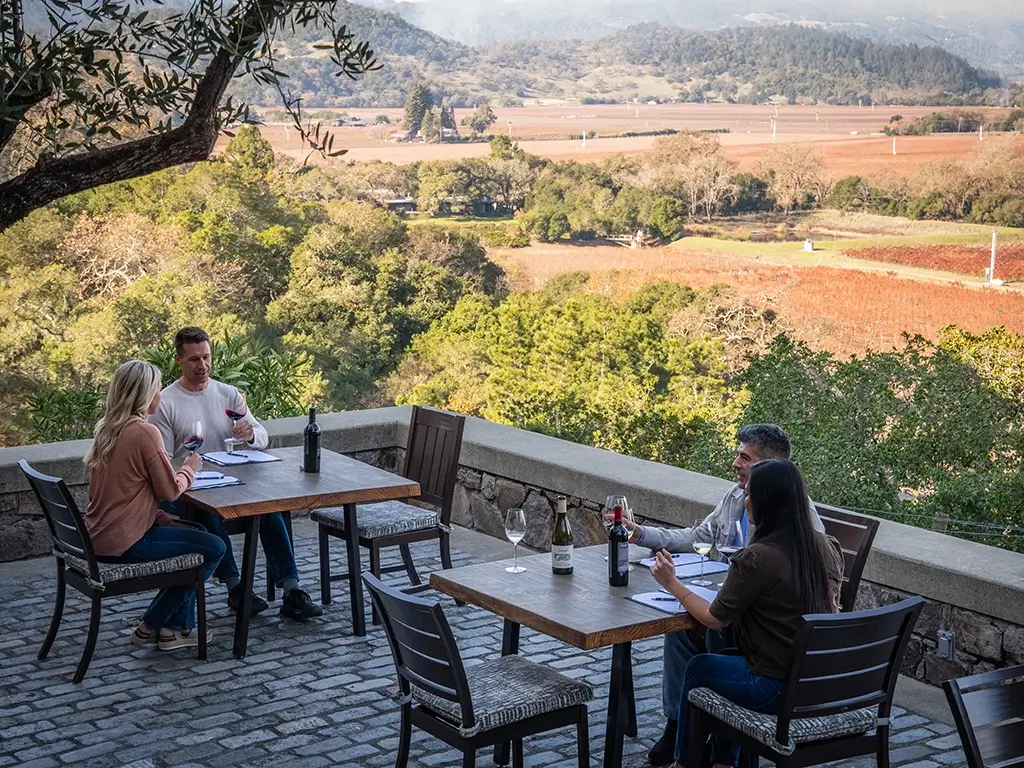 Guests enjoying a wine tasting on the outdoor terrace at Silverado Vineyards